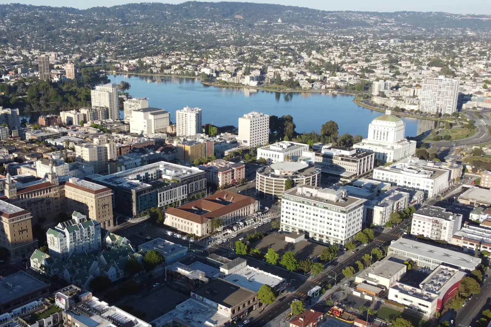 Lake Merritt surrounded by downtown Oakland buildings and neighborhoods